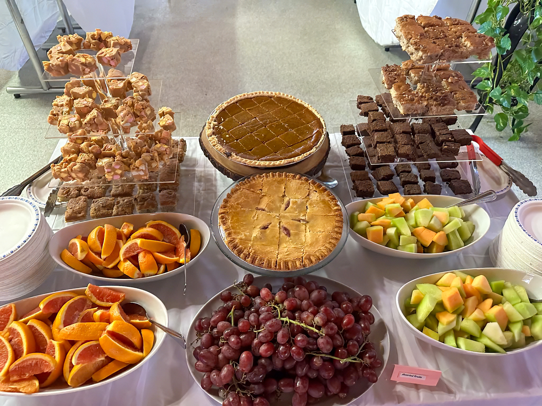 Warm dining spread — generous homemade food laid out for a gathering, catered by RR & 3A's Cafe